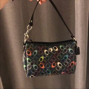 Coach multicolored mini purse and wallet set.